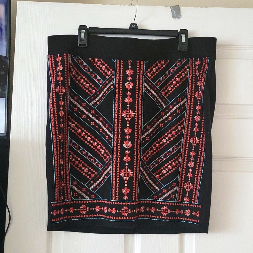 Torrid skirt with embroidery detail on the front.